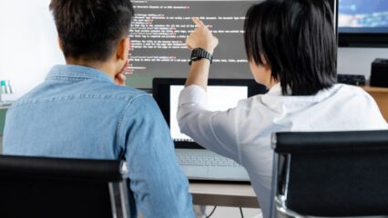 back view of a people looking the monitor